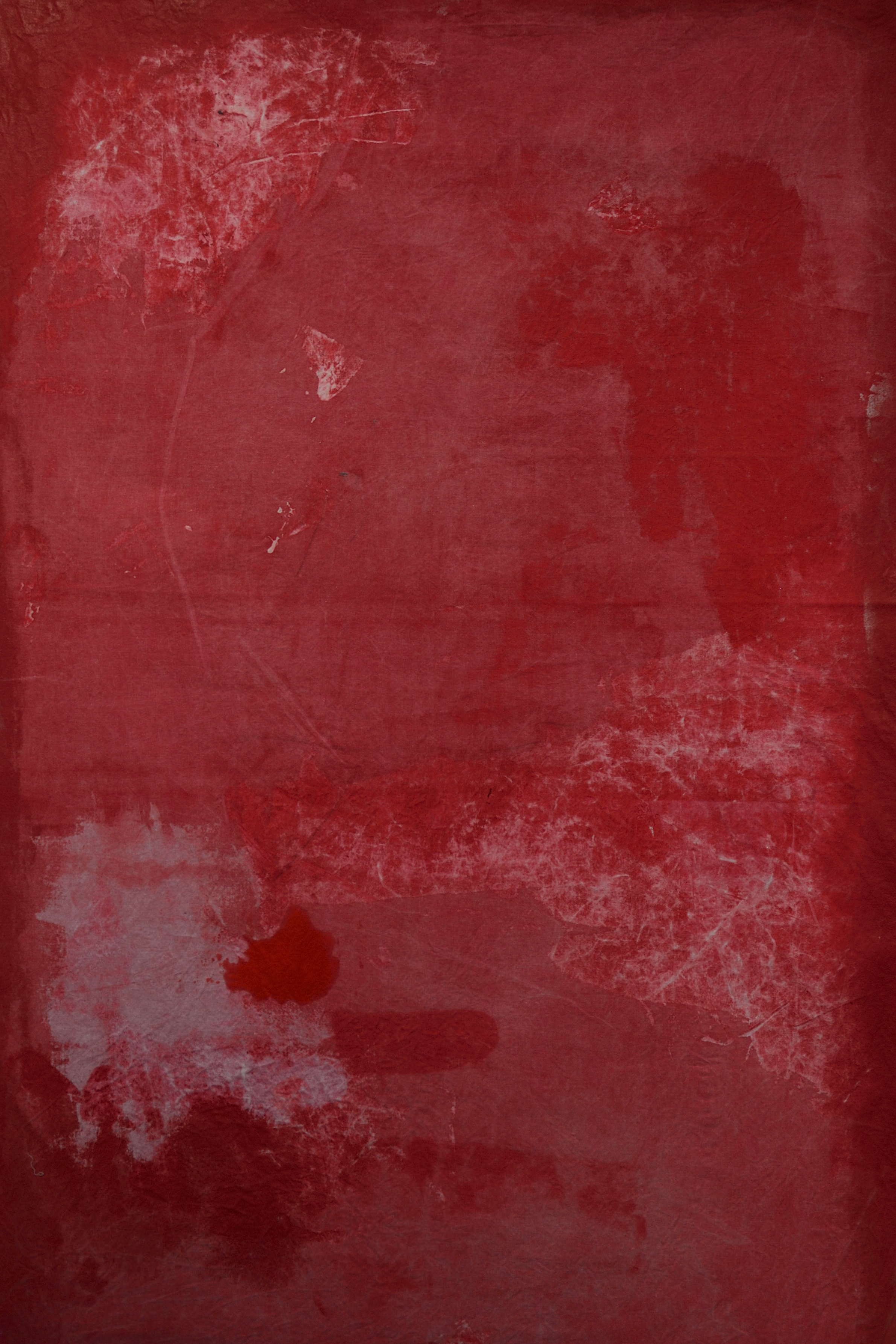 Deep red abstract artwork on cloth by Roxana Donaldson, featuring organic stains and textures