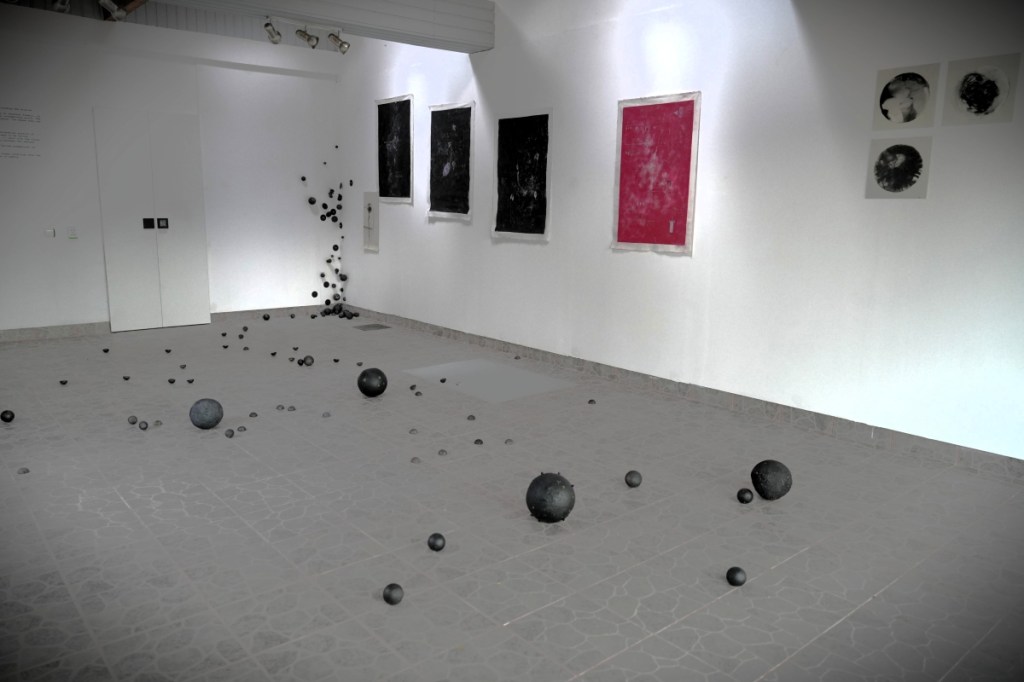 Exhibition View - audience near stratified pink exhibition archive Roxana Donaldson, 2025