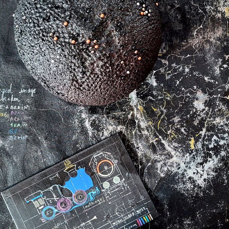 Roxana Donaldson, Safety First art installation 3, Assemblage art black spheres, detail, 2025. Black porous sphere with pins, wires and nails on a white wall in official Safety First the Aftermath exhibtion, Bucharest, Galeria Calea Victoriei 91-93, 2025.